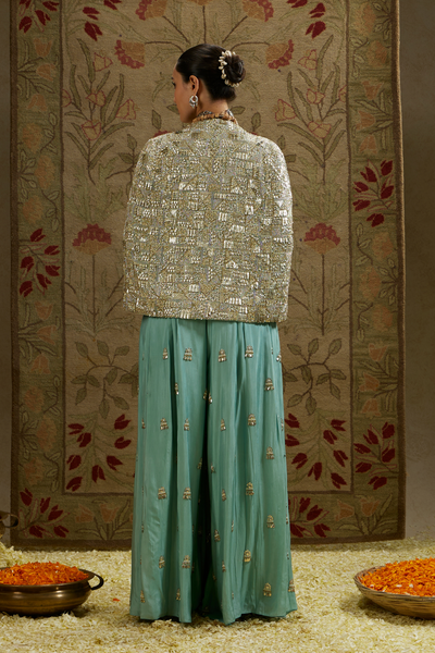 Metallic Cape Jacket Paired with Metallic Bustier and Embellished Pleated Pants