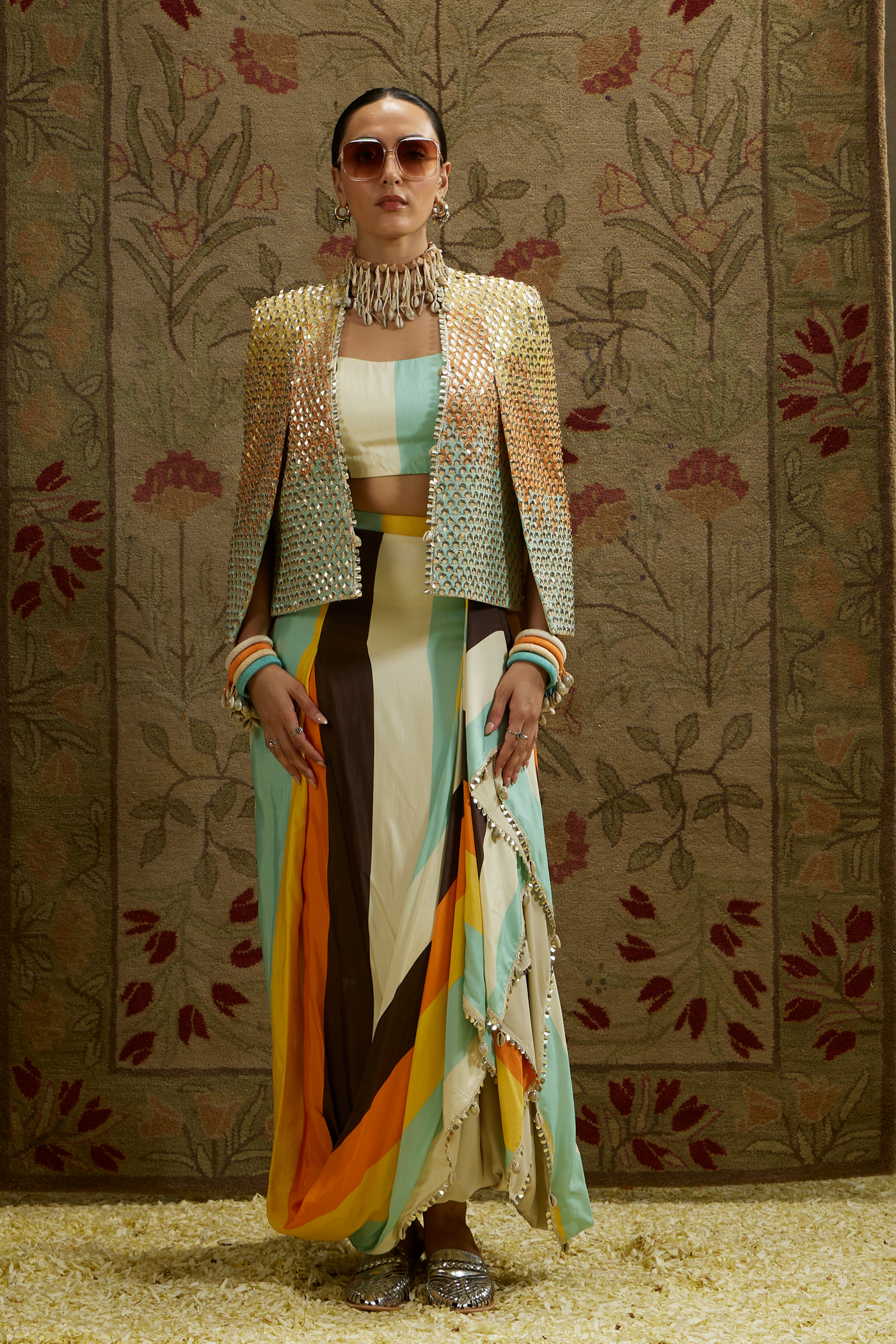 SVA Womenswear Multi Colored Metallic Cape Jacket Paired with Stripe Printed Bustier and Drape Skirt Indian Designer Wear Online Shopping Melange Singapore