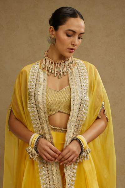 SVA Womenswear Metal Embellished Bustier Paired with Organza Cape and Dandelion Yellow Drape Skirt Online Shopping Melange Singapore Indian Designer Wear