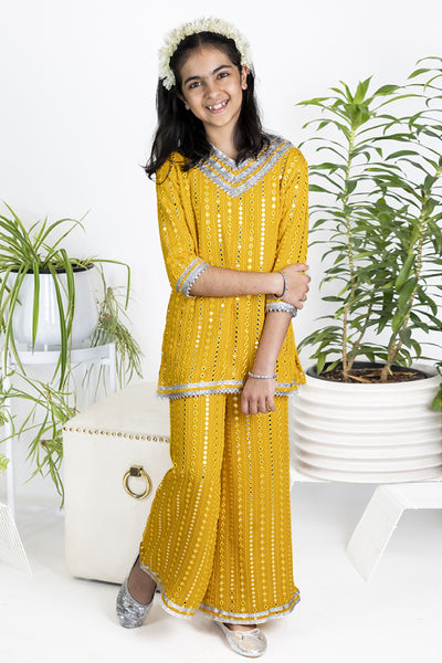 The Story Brand Stardust Short Kurta And Palazzo Set In Mango Foil Mirror indian designer wear online shopping melange singapore