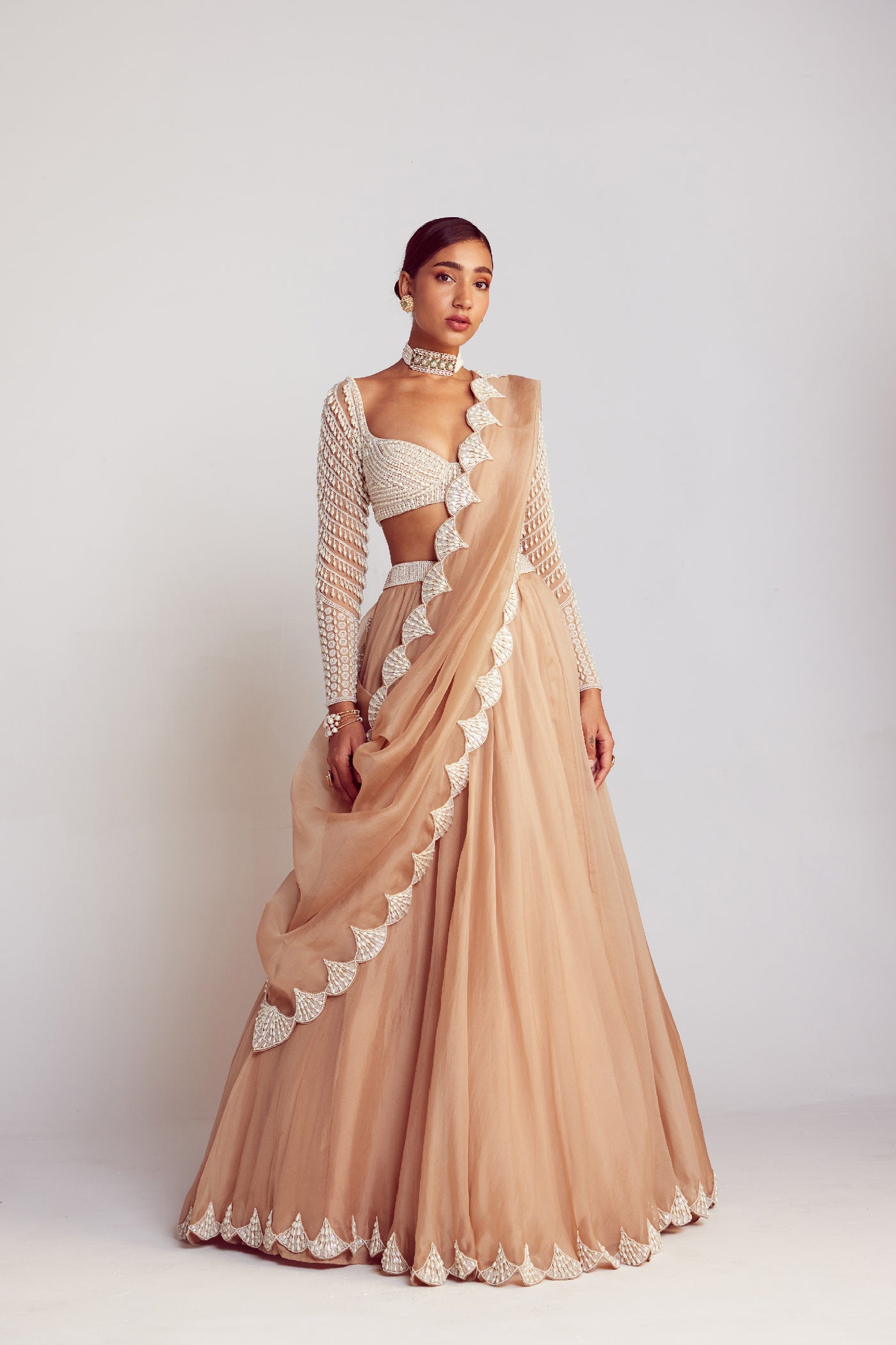 V Vani Vats Beige Pearl Embellished Lehenga Paired With Sweetheart Neck Pearl Drop Full Sleeve Blouse Indian designer wear online shopping melange singapore