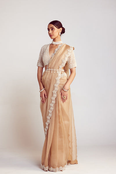 V Vani Vats Beige Pearl Embellished Organza Saree Paired With V Neck Elbow Sleeve Pearl Drop Blouse Indian designer wear online shopping melange singapore