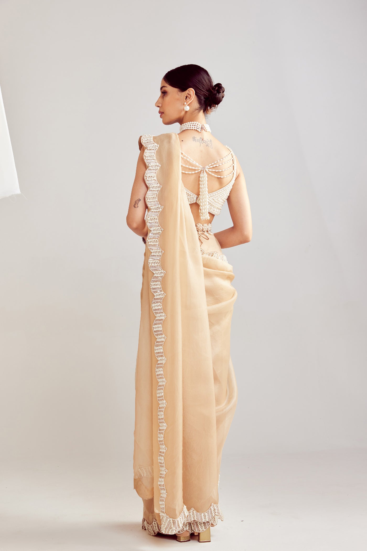 V Vani Vats Beige Pearl Embellished Saree Paired With Sweetheart Neck Blouse Indian designer wear online shopping melange singapore