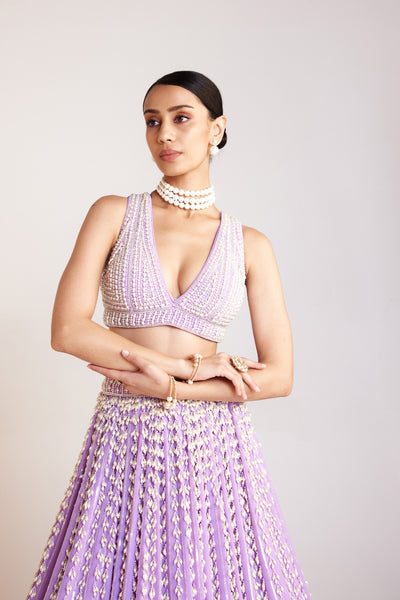 V Vani Vats Lilac Chandelier Pearl Lehenga Paired With V Neck Heavily Embellished Pearl Blouse Indian designer wear online shopping melange singapore