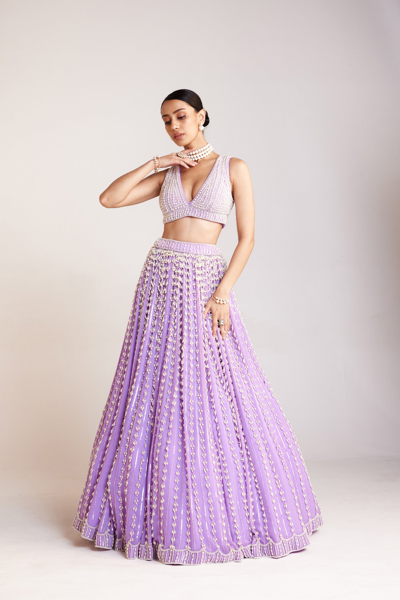 V Vani Vats Lilac Chandelier Pearl Lehenga Paired With V Neck Heavily Embellished Pearl Blouse Indian designer wear online shopping melange singapore