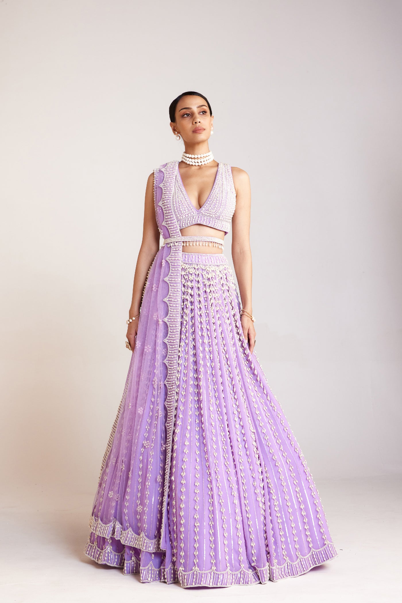 V Vani Vats Lilac Chandelier Pearl Lehenga Paired With V Neck Heavily Embellished Pearl Blouse Indian designer wear online shopping melange singapore