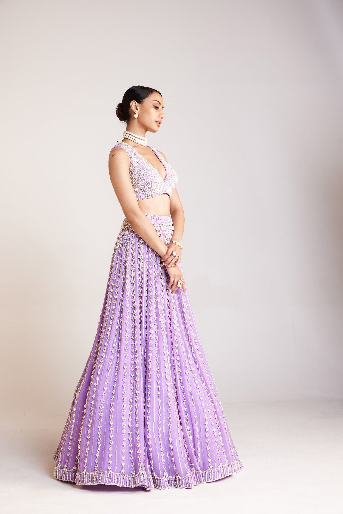 V Vani Vats Lilac Chandelier Pearl Lehenga Paired With V Neck Heavily Embellished Pearl Blouse Indian designer wear online shopping melange singapore