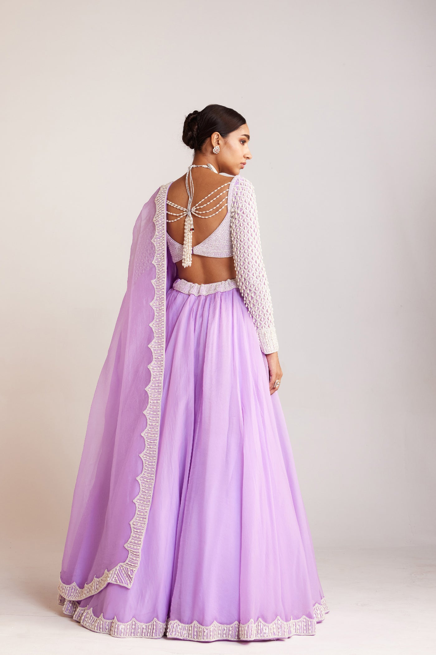 V Vani Vats Lilac Pearl Embellished Organza Lehenga Paired With Sweetheart Neck Pearl Drop Full Sleeve Blouse Indian designer wear online shopping melange singapore