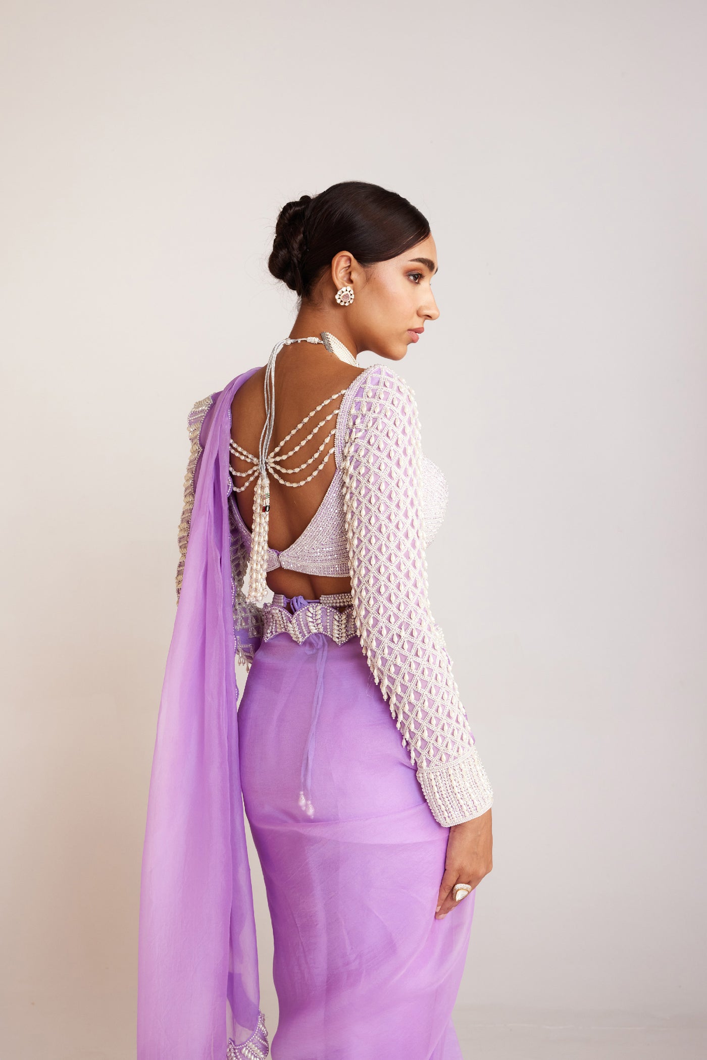 V Vani Vats Lilac Pearl Embellished Saree Paired With Pearl Drop Full Sleeves Blouse Indian designer wear online shopping melange singapore