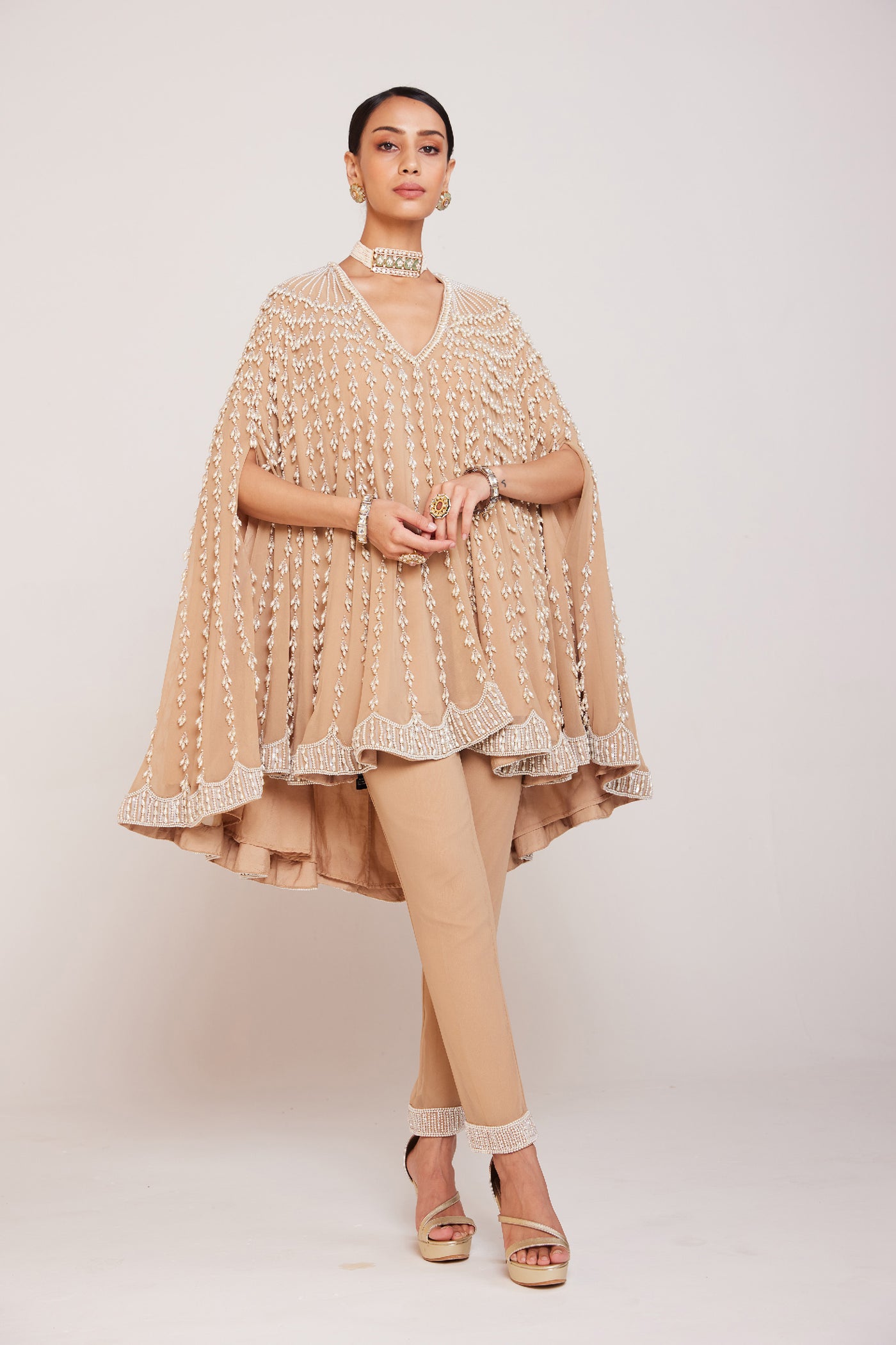 V Vani Vats Pearl Embellished Beige Asymmetrical Cape Paired With Pants Indian designer wear online shopping melange singapore