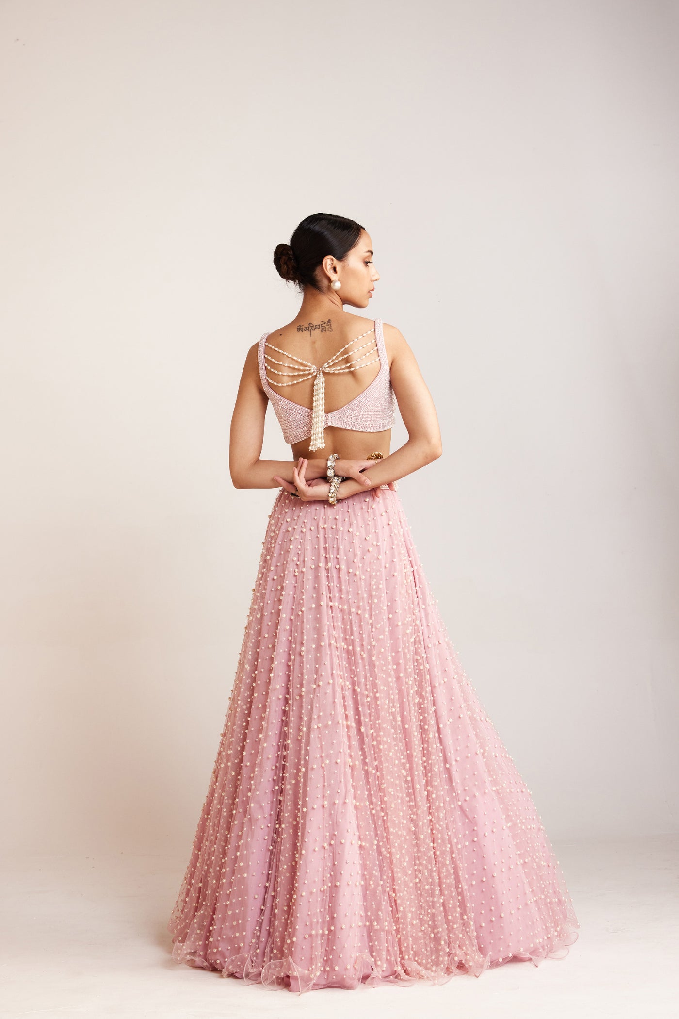 V Vani Vats Powder Pink Dense Pearl Lehenga Paired With Heavily Embellished Pearl Indian designer wear online shopping melange singapore