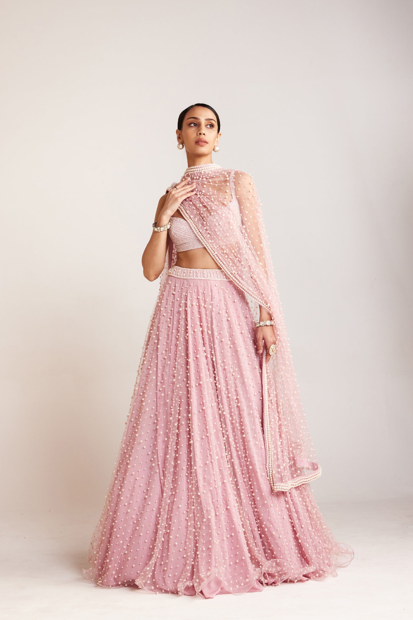 V Vani Vats Powder Pink Dense Pearl Lehenga Paired With Heavily Embellished Pearl Indian designer wear online shopping melange singapore