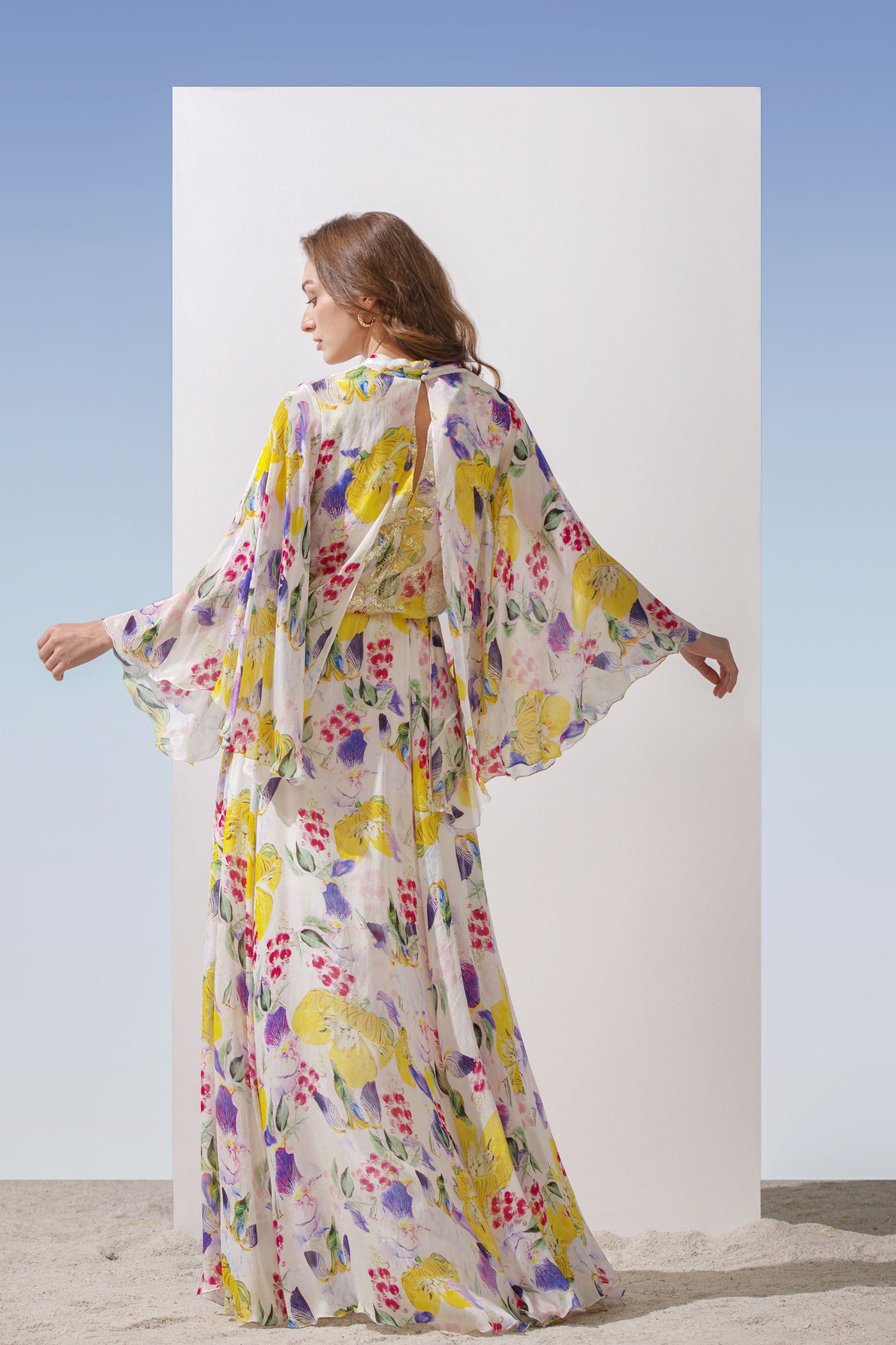 Mandira Wirk Chiffon printed long dress with cowled neckline, brasso printed yoke, front slits bottom with frills yellow western indian designer wear online shopping melange singapore 