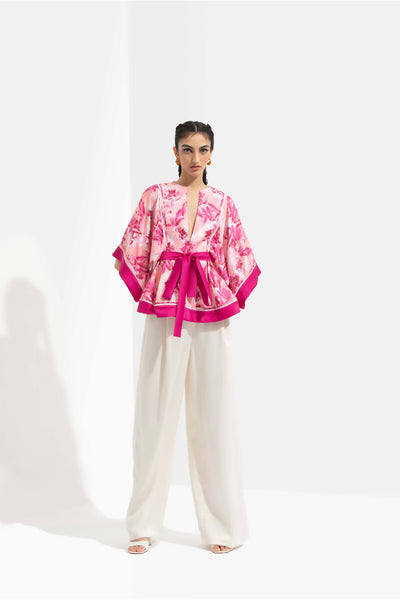 Mandira Wirk Sakura printed satin peplum top with kimono sleeves and deep pink color blocked facing, paired with ivory pants pink western indian designer wear online shopping melange singapore 