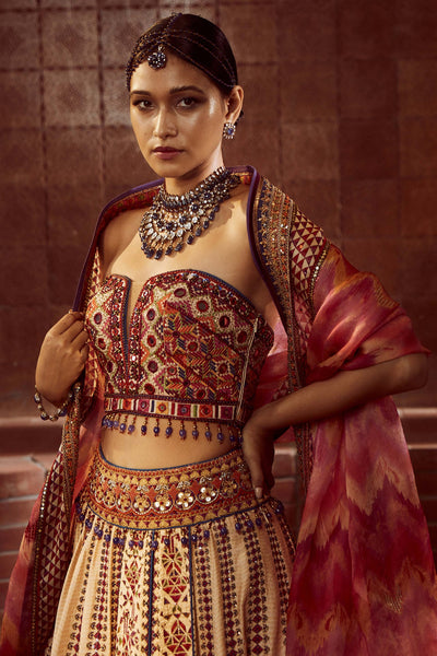 Tarun Tahiliani Stylised Kalidar Lehenga With Patchwork Of Zardozi And Aari Embroidery, Paired With Mirror And Resham-Embroidered Corset And Hand-Printed Dupatta multicolor festive indian designer wear online shopping melange singapore