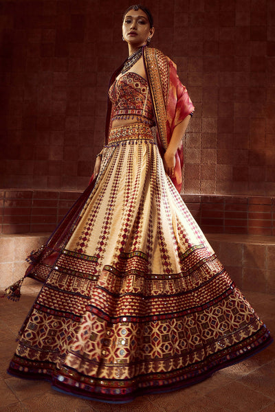 Tarun Tahiliani Stylised Kalidar Lehenga With Patchwork Of Zardozi And Aari Embroidery, Paired With Mirror And Resham-Embroidered Corset And Hand-Printed Dupatta multicolor festive indian designer wear online shopping melange singapore 