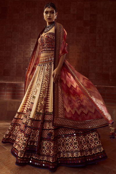 Tarun Tahiliani Stylised Kalidar Lehenga With Patchwork Of Zardozi And Aari Embroidery, Paired With Mirror And Resham-Embroidered Corset And Hand-Printed Dupatta multicolor festive indian designer wear online shopping melange singapore