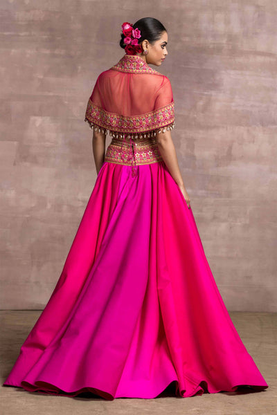 Tarun Tahiliani Tussar Draped Lehenga With Embroidered Hip Yoke And Bustier With Embroidered Sheer Cape fuchsia pink festive indian designer wear online shopping melange singapore
